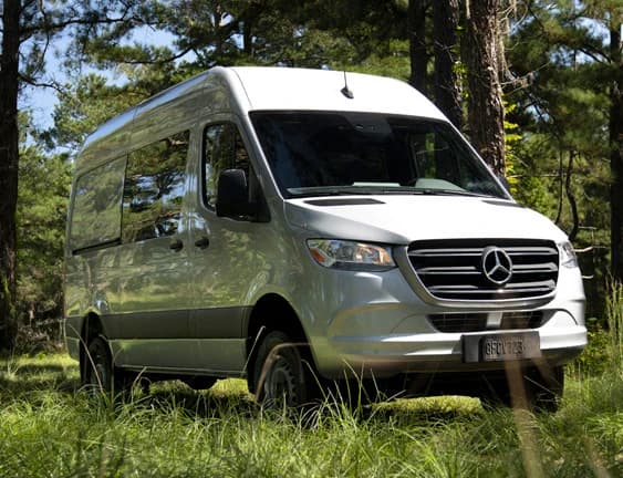 Mercedes-Benz Sprinter van in a forest setting